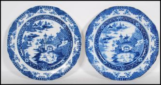 A pair of 19th Century English pearlware blue and white printed plates depicting with a landscape