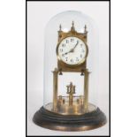 An antique late 19th / early 20th century brass and enamel anniversary clock. With pendulum. Mounted