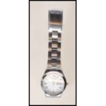 A Seiko gentleman's stainless steel wrist watch having a round white face with silvered baton
