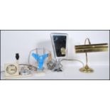 A collection of vintage and retro items to include a brass bankers desk lamp, a retro desk fan,