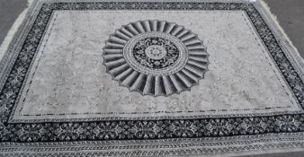 A large Persian floor carpet Keshan rug having a black ground with geometric borders and central