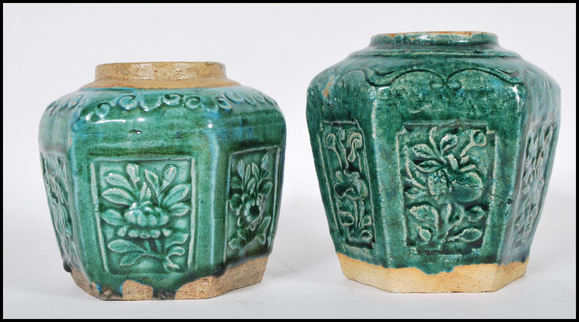 A pair of late 19th Century Chinese stoneware ginger jars of hexagonal form having panels of