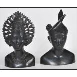 A pair of 20th Century carved hardwood South East Asian / Malaysian busts of a male and female