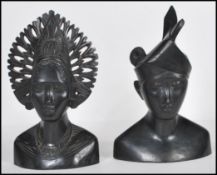 A pair of 20th Century carved hardwood South East Asian / Malaysian busts of a male and female