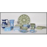 A collection of 14 pieces of Wedgwood jasperware ceramics to include a cobalt jug dating to the late