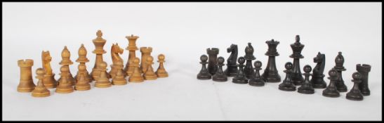 A vintage early 20th Century complete Chess set having boxwood and ebonised pieces complete in