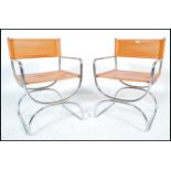 A pair or retro 20th Century chrome framed cantilever armchairs in the manner of Mart Stam, the seat