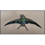 A stamped 925 silver and marcasite brooch pendant in the form of a swallow bird having enamel plique