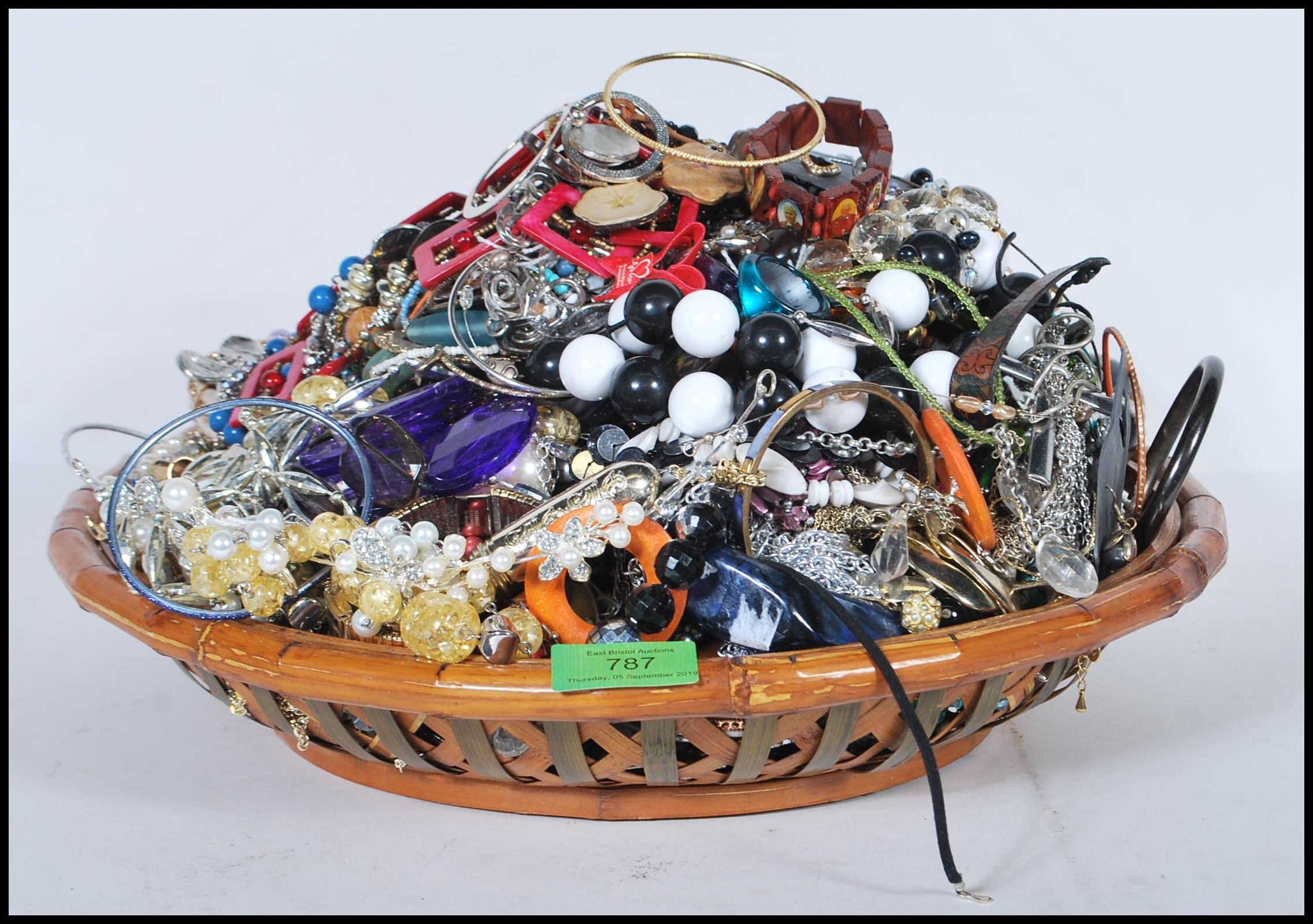 A collection of vintage and contemporary costume jewellery to include bracelets, bangles, necklaces,