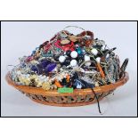 A collection of vintage and contemporary costume jewellery to include bracelets, bangles, necklaces,
