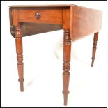 A 19th Century mahogany Pembroke dining table with fitted single drawer raised on turned supports