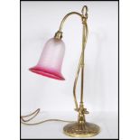 A vintage mid 20th Century swan neck desk lamp raised on a stepped round base with gadrooned and