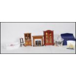 A good collection of assorted scale dolls house wares to include china cabinet, chair, fire place,