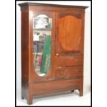 A good quality inlaid Edwardian mahogany compactum wardrobe with satinwood banding, mirrored door