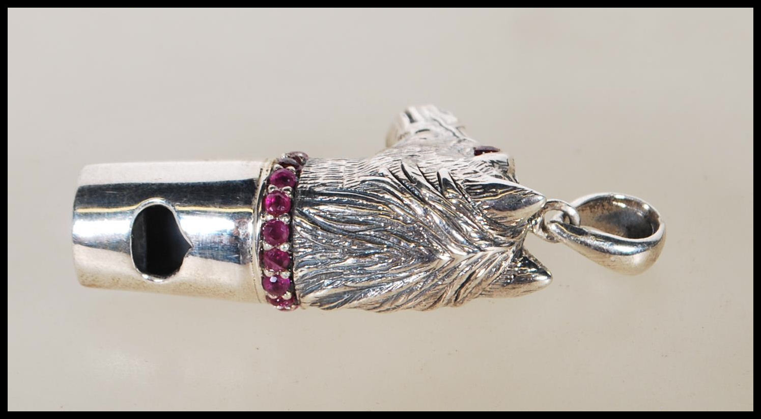 A silver novelty whistle pendant in the form of a horse head set with ruby eyes and having a ruby - Image 2 of 6