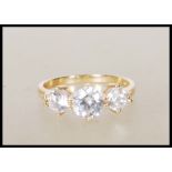 A 14ct gold English hallmarked ladies ring set with three round cut CZ stones. Hallmarked Birmingham