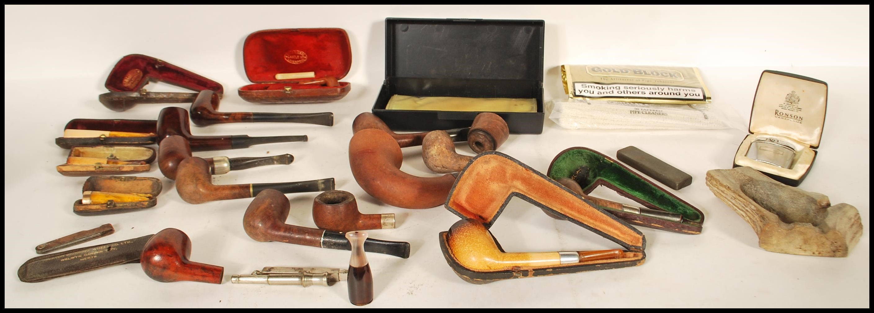 A good collection of vintage smoking tobacco pipes and accessories to include various leather