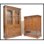 An Old Charm carved oak lead glaze Linen Fold  bookcase over cupboard base with linen fold