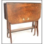 A 19th Century Victorian rosewood drop leaf inlaid folding extendable Sutherland table having railed