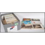 A shoebox full of various mixed postcards dating from the early 20th Century to include church