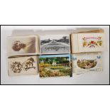 A group of 20th Century postcards and cigarette cards to include various black and white examples,