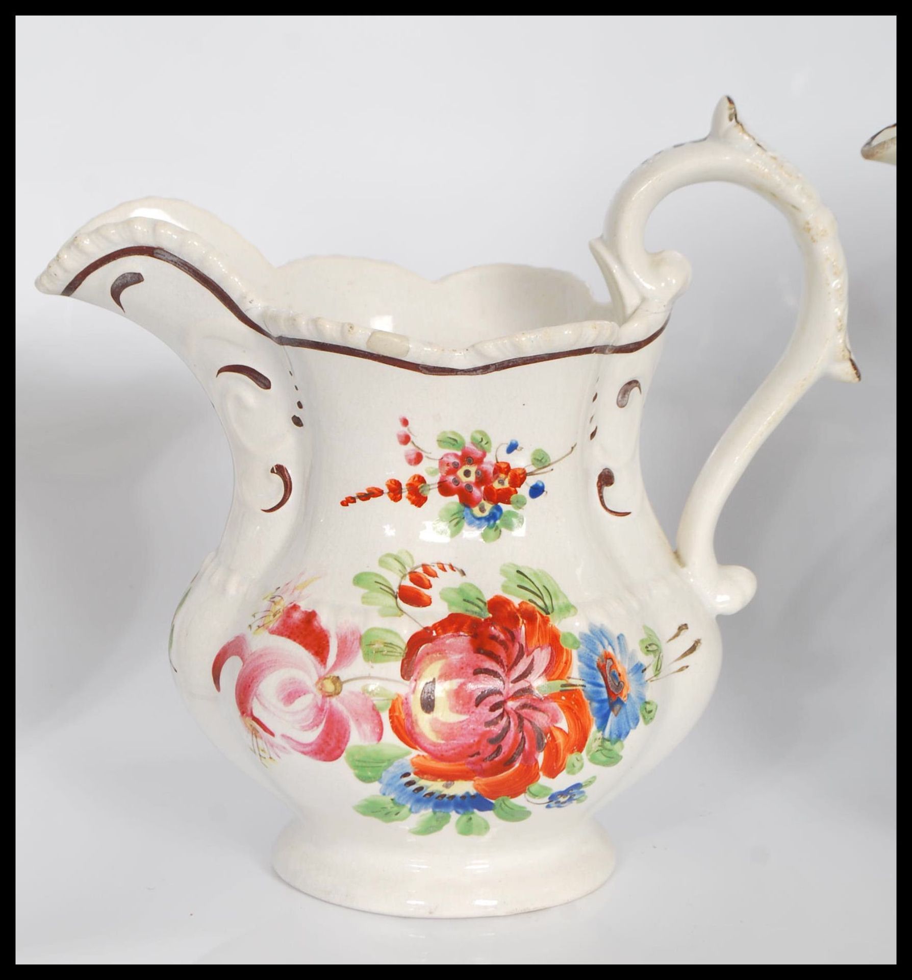 A group of three 19th Century Staffordshire jugs all having hand painted floral sprays to include - Bild 3 aus 7