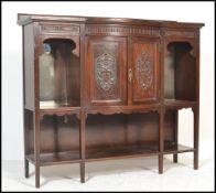 An early 20th Century Edwardian mahogany chiffonier sideboard with central carved panel cabinet