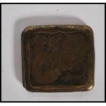 A vintage 1940's Chinese brass cigarette case of square engraved with decorative panels to the front