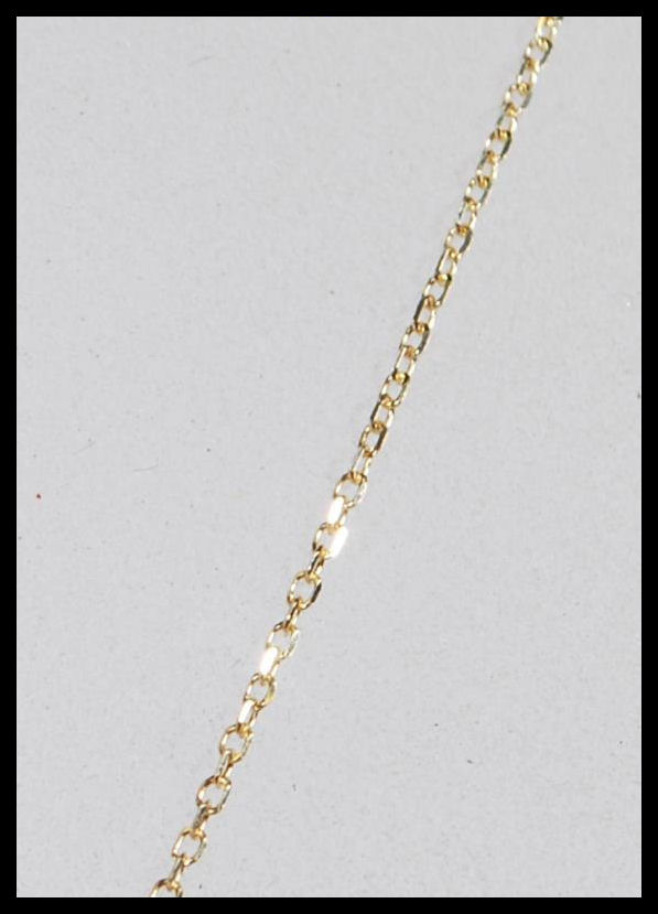 A hallmarked 18ct yellow gold necklace having a pendant in the form of a four leaf clover set with - Image 4 of 6