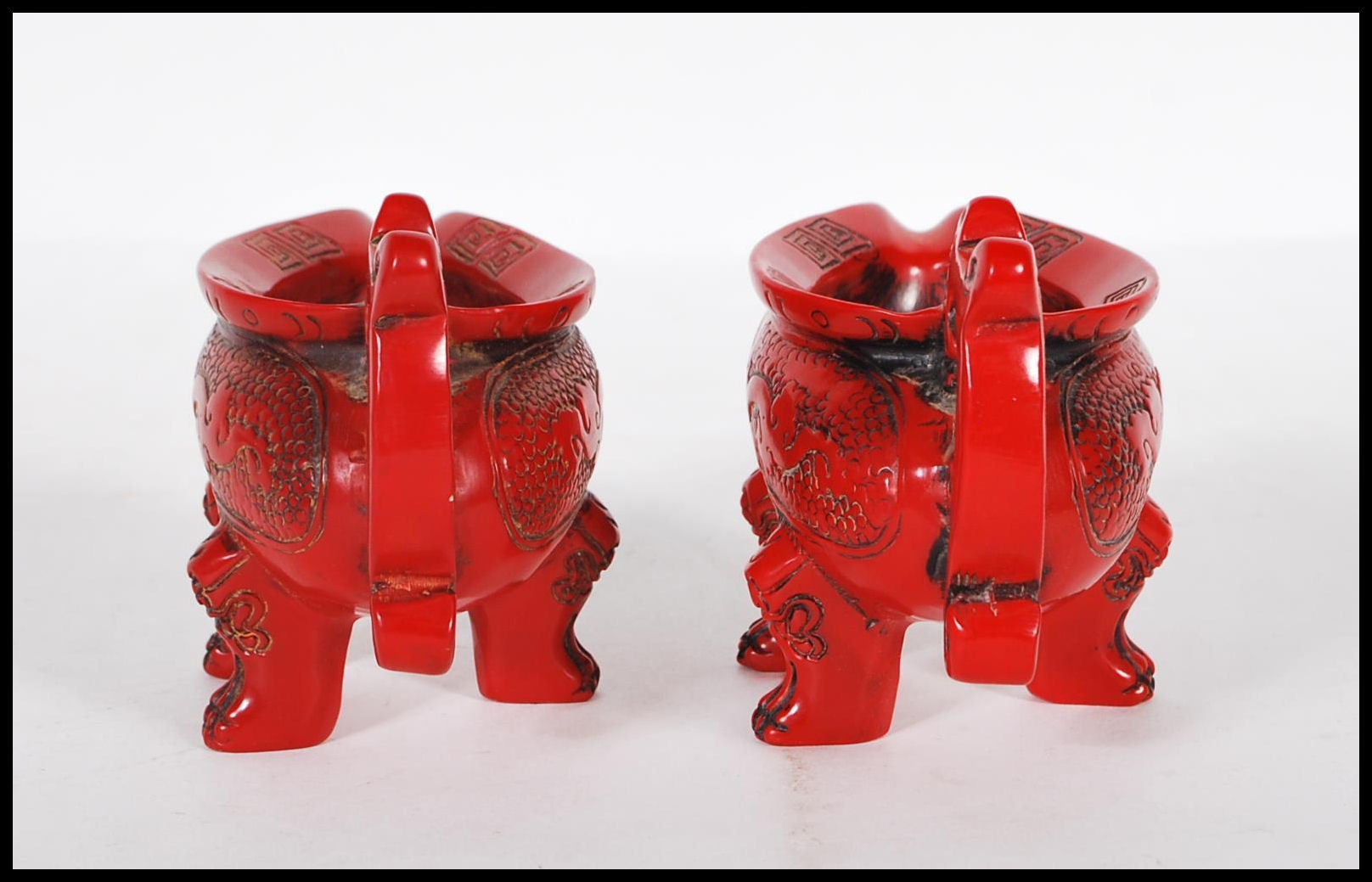 A pair of 20th Century Chinese faux Cinnabar lacquer oil pourers having scrolled decoration with - Image 4 of 6