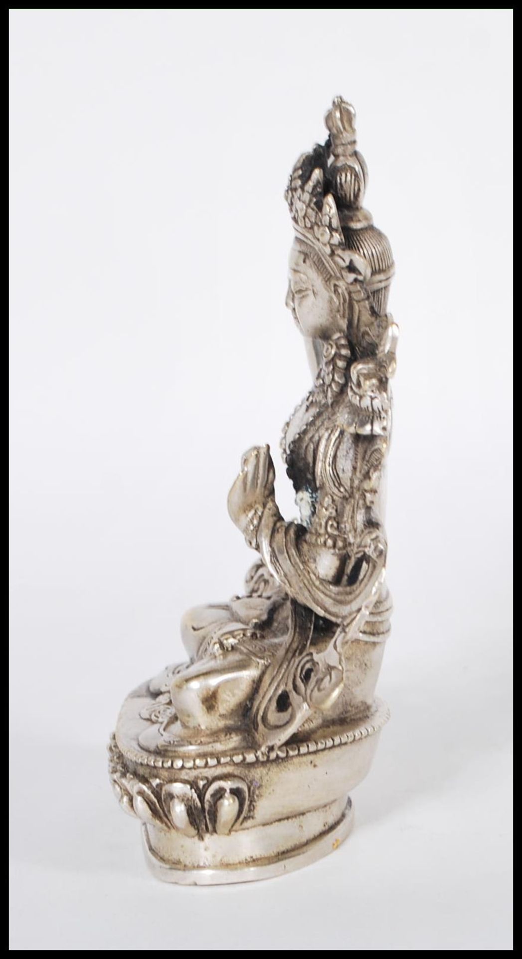 A 20th Century Tibetan white brass figure of Bodhisattva Manjushri seated crossed legged on a - Bild 4 aus 6