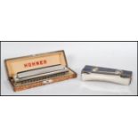 Two early 20th Century German harmonicas / mouth organs to include to include a Hohner 64 Chromonica