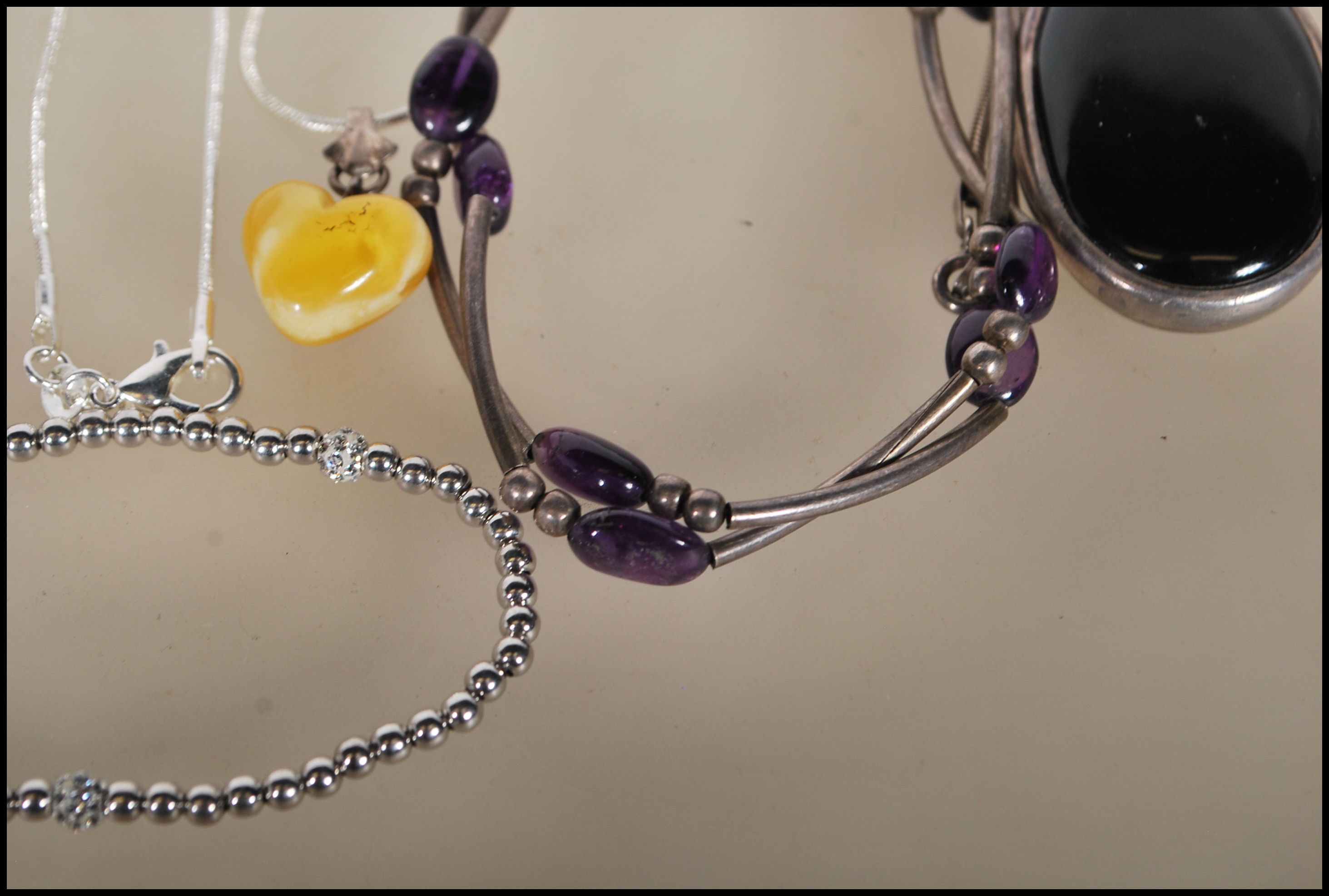 A selection of silver necklaces to include a spacer necklace with purple beads, a snake chain - Image 3 of 8