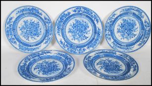 A group of five 19th Century English blue and white plates having transfer printed floral sprays