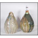 A pair of retro 20th Century studio pottery drip glaze bedside / table lamps of teardrop conical