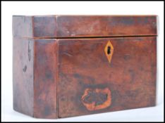 A late 18th Century Georgian tea caddy having canted corners with scutcheon to the front and