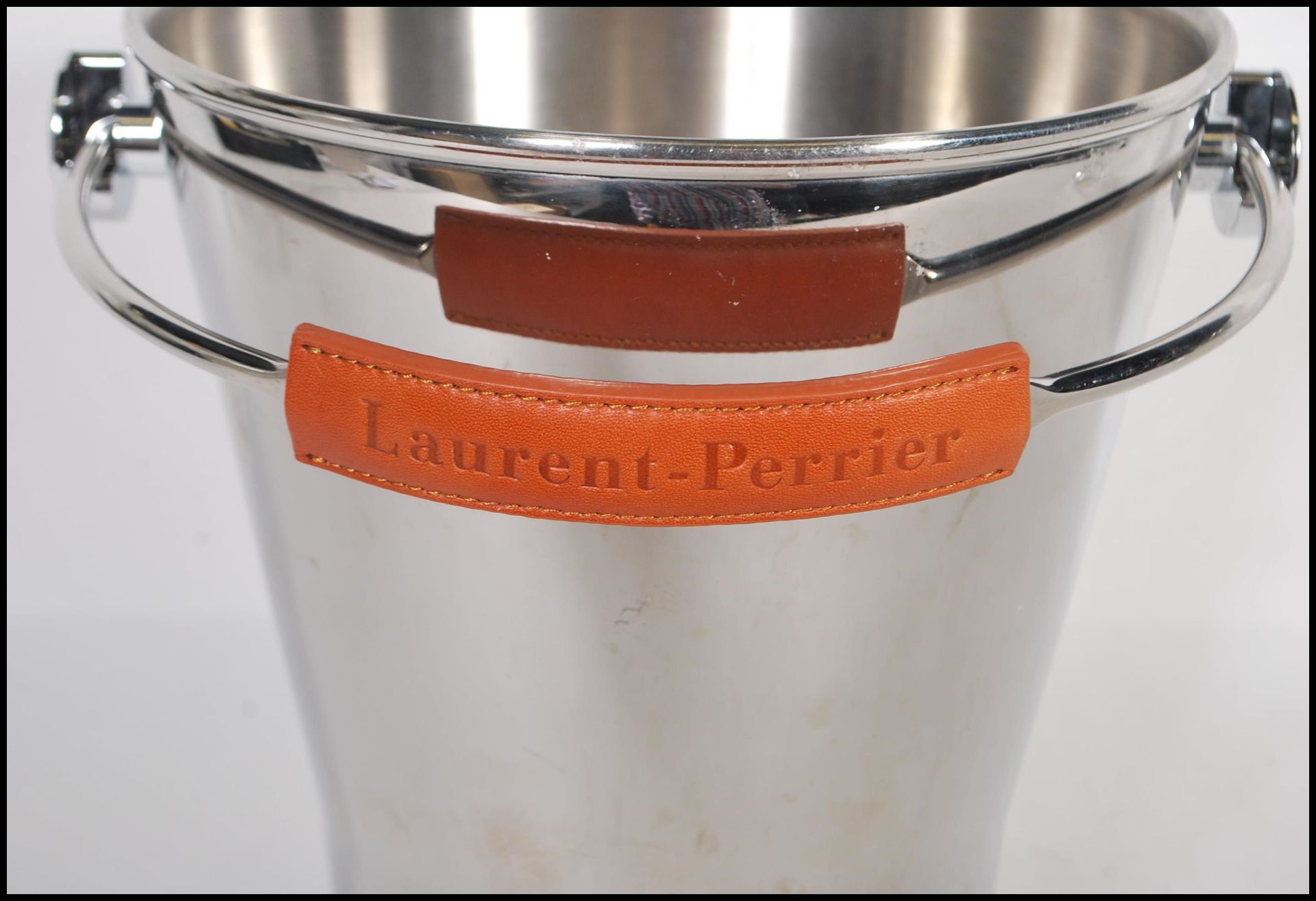 A vintage Laurent Perrier brushed steel champagne ice bucket having a leather swing handle and - Bild 4 aus 4