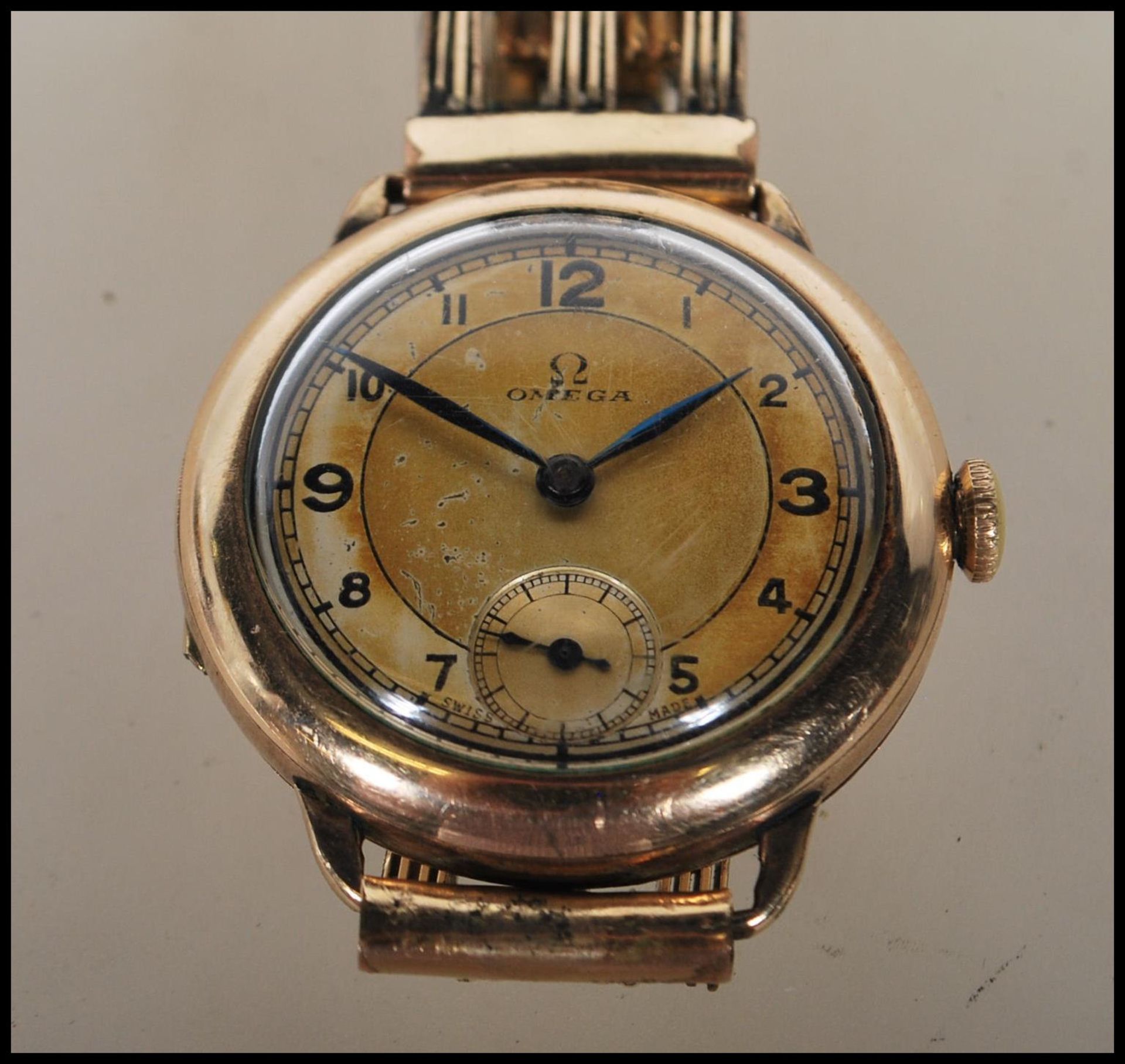 A vintage 1930's 15 jewels Omega gentleman's gold plated wrist watch having a round gilt face with - Bild 2 aus 7