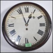 A 19th century Victorian mahogany station clock of circular form having a fusee brass movement.