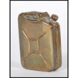 A vintage 20th Century French made copper perfume bottle circa 1940's modelled as a WWII Jerry