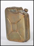 A vintage 20th Century French made copper perfume bottle circa 1940's modelled as a WWII Jerry