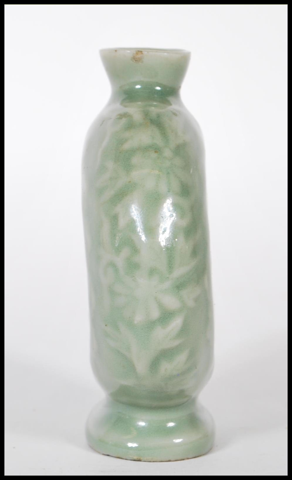 A 19th Century Chinese ceramic bottle / moon flask having a green glaze finish with floral relief - Image 3 of 7