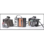 A collection of three original vintage retro polaroid instant cameras / land camera comprising: A