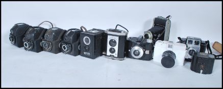 A collection of vintage 20th Century roll film cameras to induced makes form mostly Kodak, various