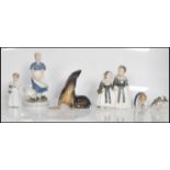 A collection of Royal Copenhagen figurines to include no. 1316 figure group of two milk maids, no.