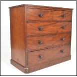 A 19th Century mahogany two over three graduating chest of drawers raised on a plinth base with a