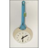 A retro mid 20th Century 1950's metal wall clock by Paico in the form of a frying pan having blue