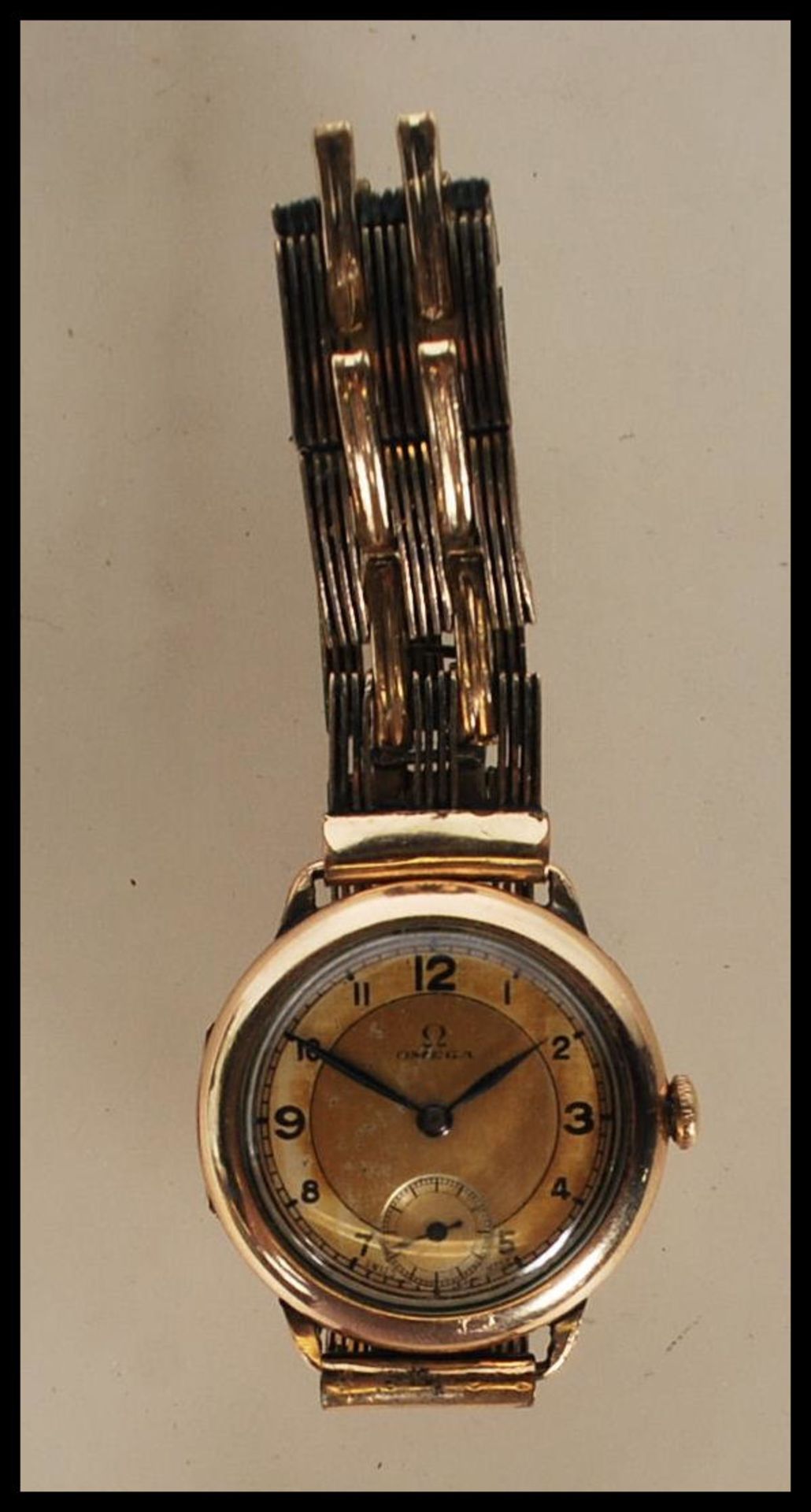 A vintage 1930's 15 jewels Omega gentleman's gold plated wrist watch having a round gilt face with