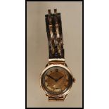 A vintage 1930's 15 jewels Omega gentleman's gold plated wrist watch having a round gilt face with