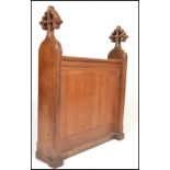 A 19th Century Victorian gothic ecclesiastical oak prayer desk panel flanked by shaped solid